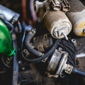 a close up of a car engine with a green light