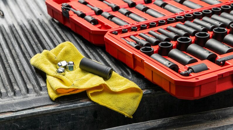 yellow textile on red and black plastic crate