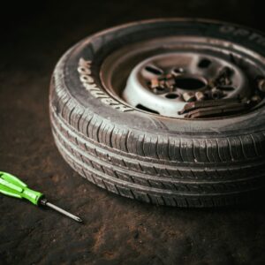 a tire with a wrench next to it