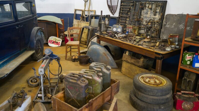 a room with old vehicles and tools