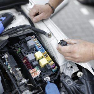 a man is working on a car's engine